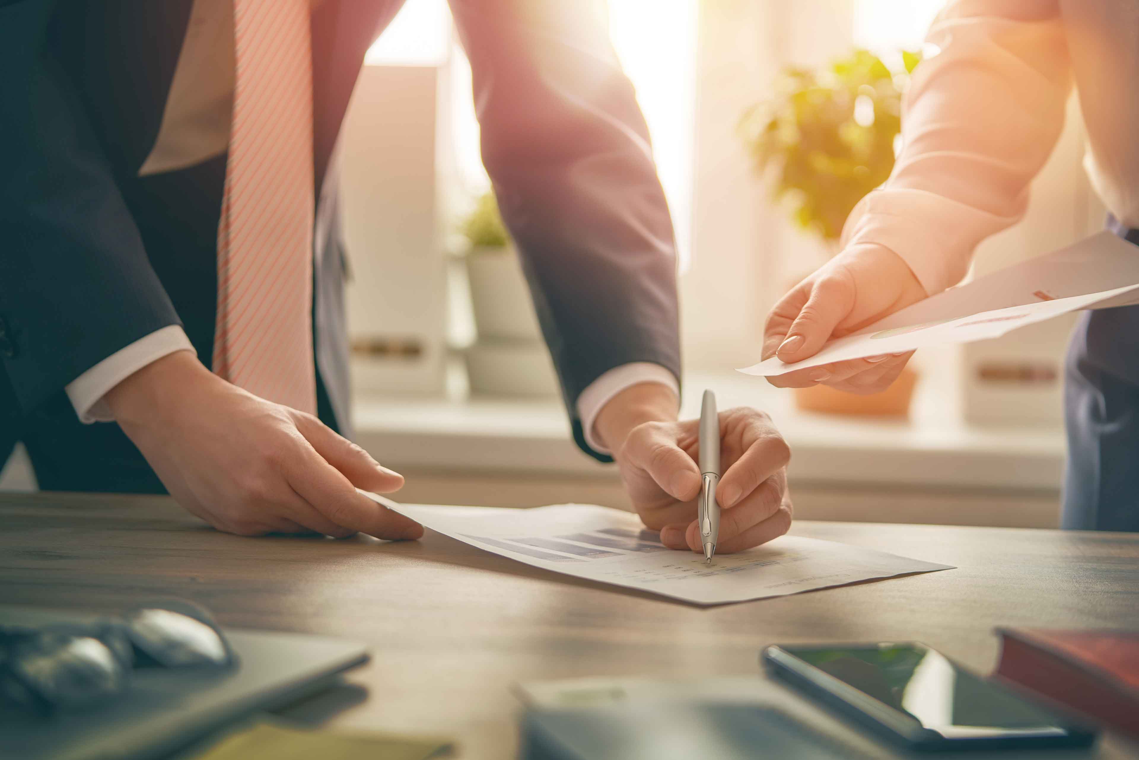 man and woman working in office