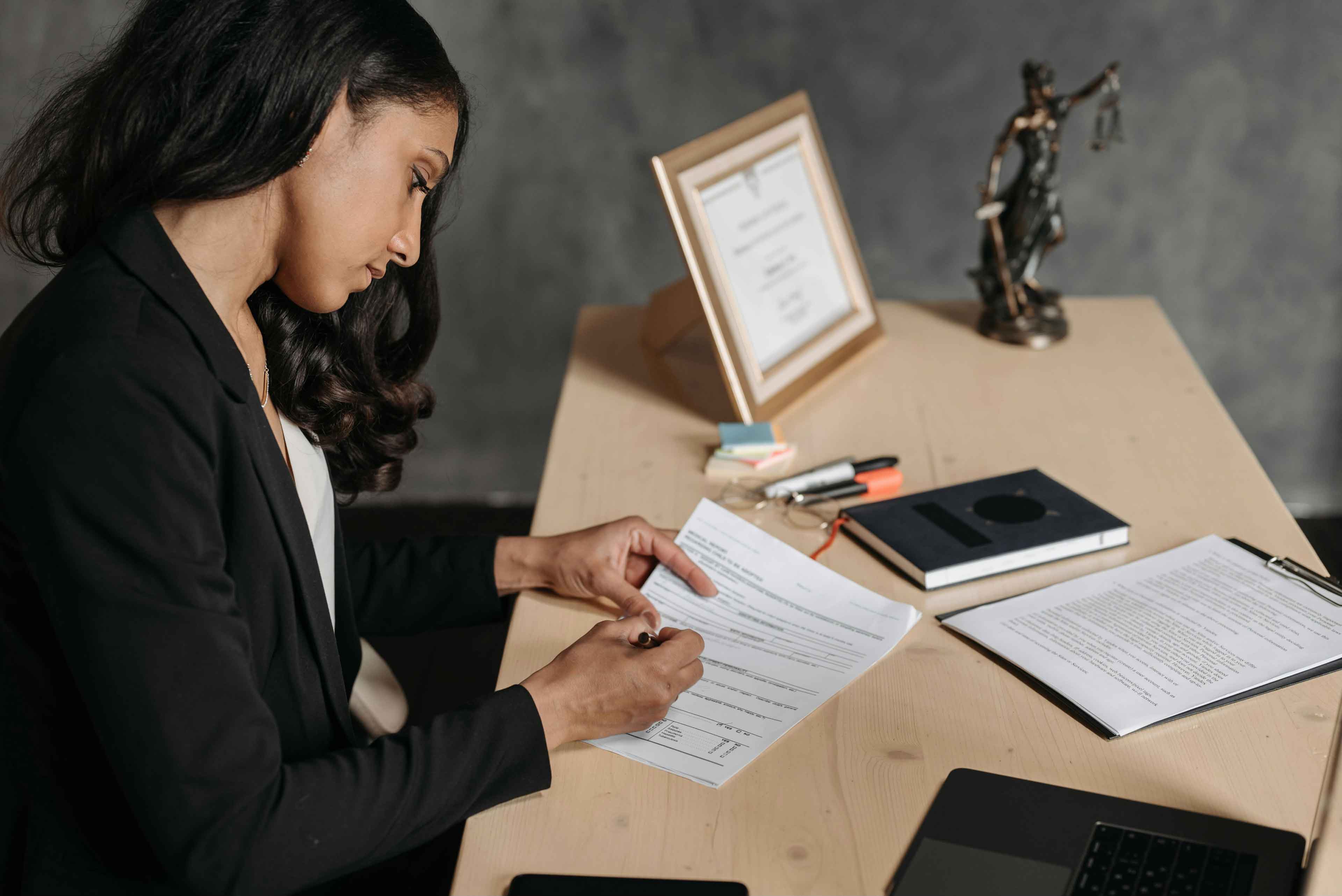 paralegal signing some case documents