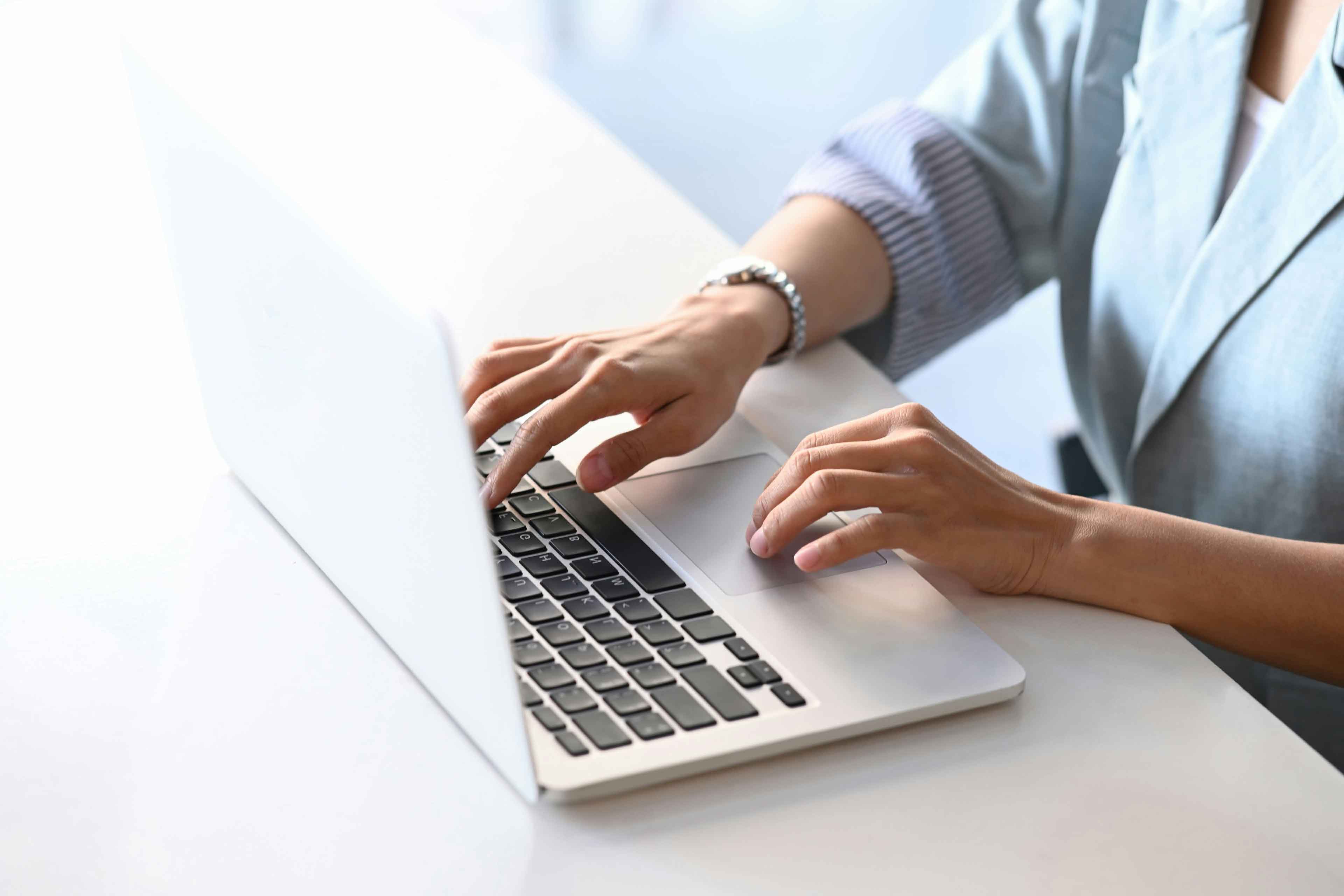 paralegal working on case data in her laptop